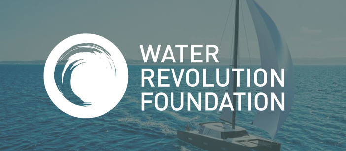 The logo of the “Water Revolution Foundation” on top of an image of a sailing ship on the sea.