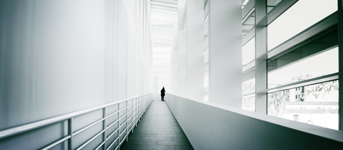 A corridor inside a building with aluminium components. 