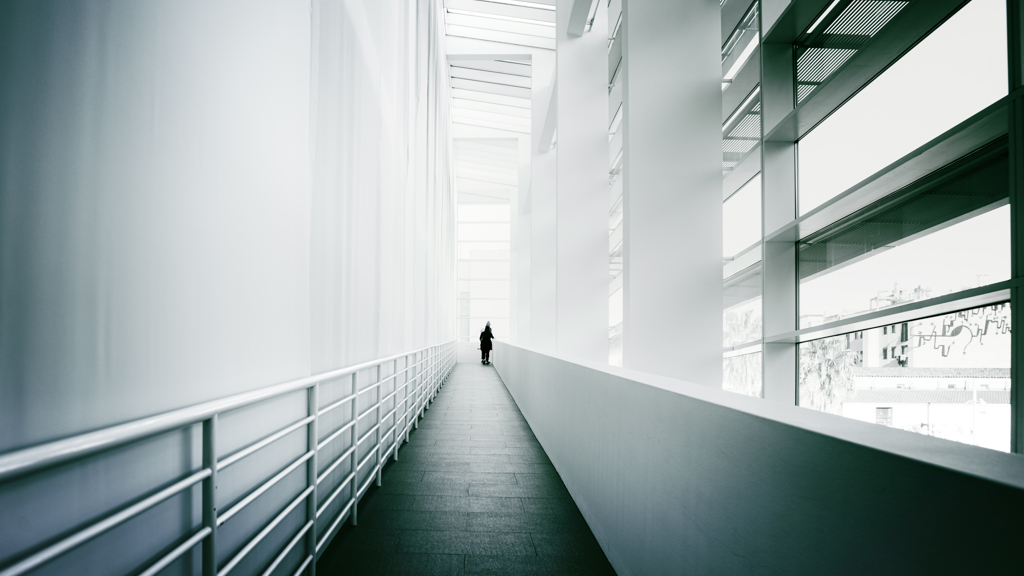 A corridor inside a building with aluminium components. 