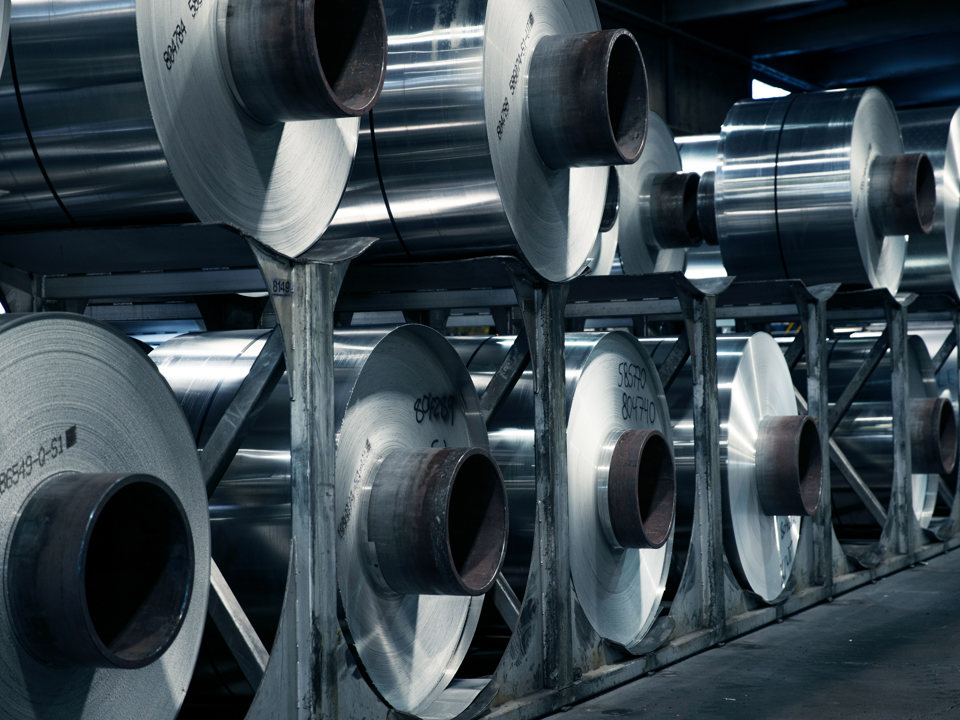 Speira’s aluminium coils stacked on top of another in a factory.