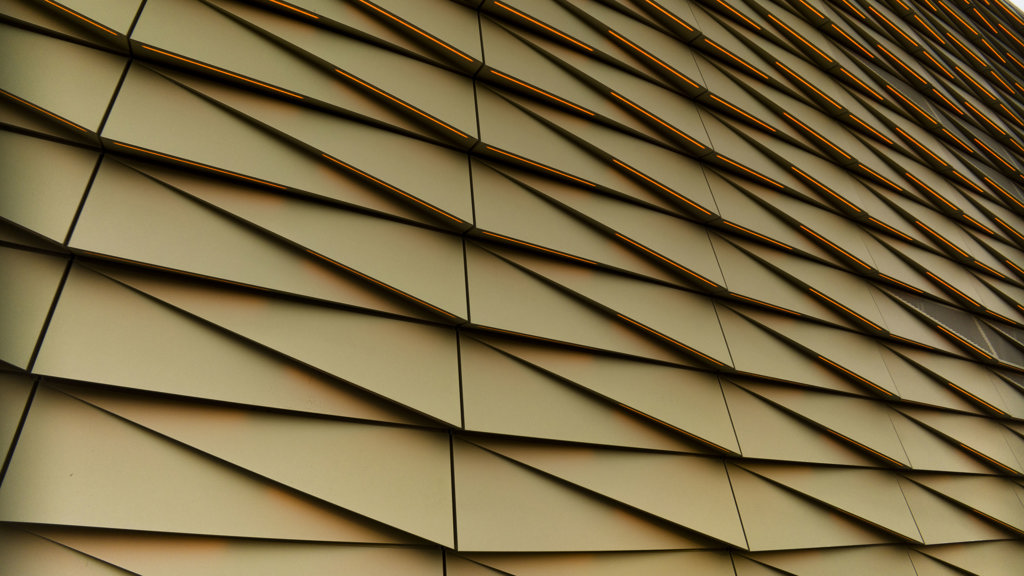 Golden tinted aluminium façade of the Casino Holland in Utrecht.