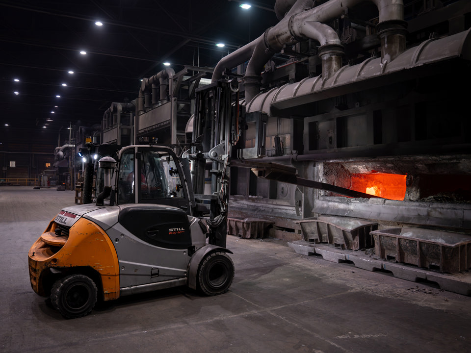 The ongoing scraping process during aluminium processing at Speira's aluminium plant.