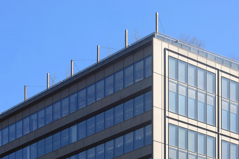 Speira’s aluminium façade of the St. John’s terminal in front of a blue sky.