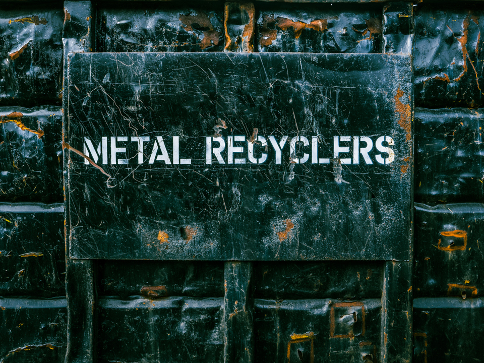 A Speira Recycling contaier with “Metal Recyclers” written on it.