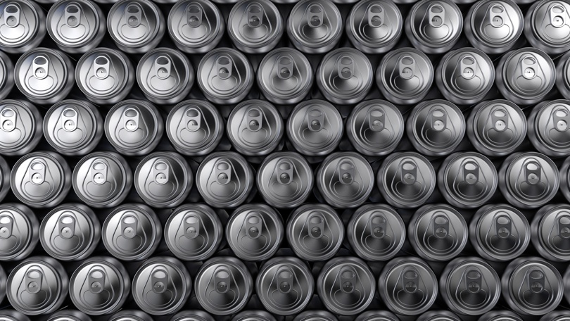 Beverage Cans lined up in a bunch.