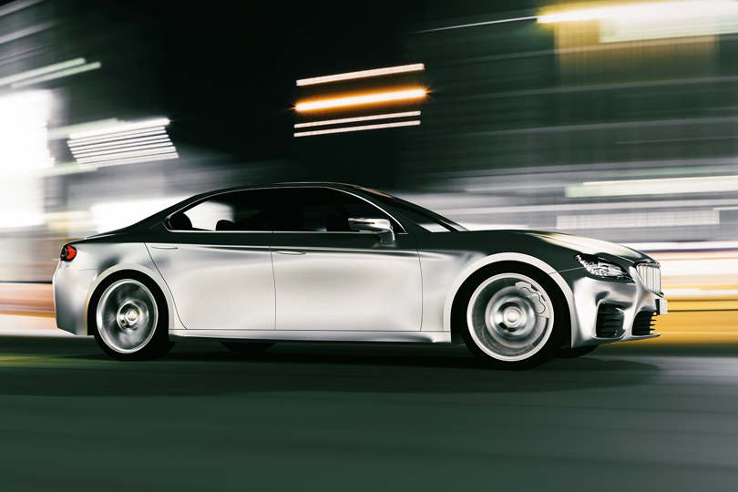 The aluminium shell of a driving car in motion.