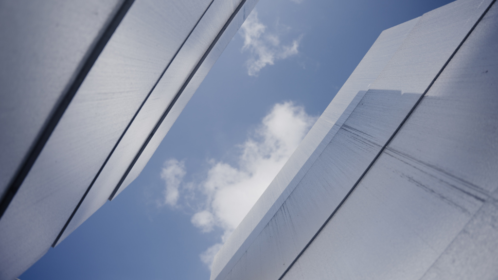 Two buildings with aluminium façades facing each other.