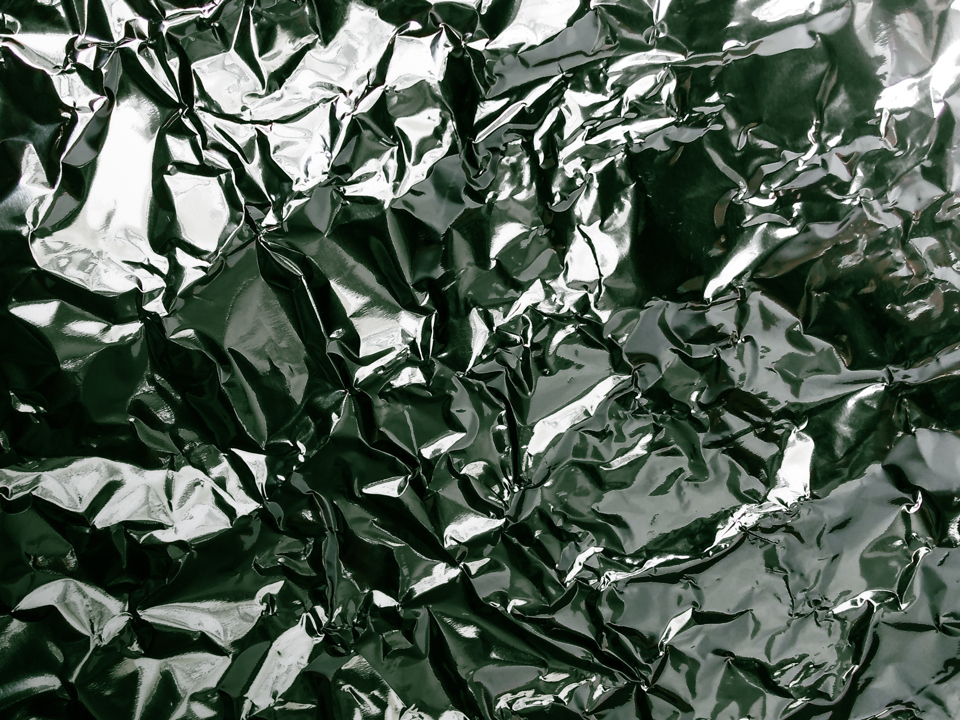 Decorative image of wrinkled aluminium foil.