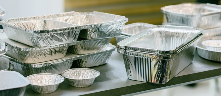 Collection of several differently-shaped food packages made of aluminium.