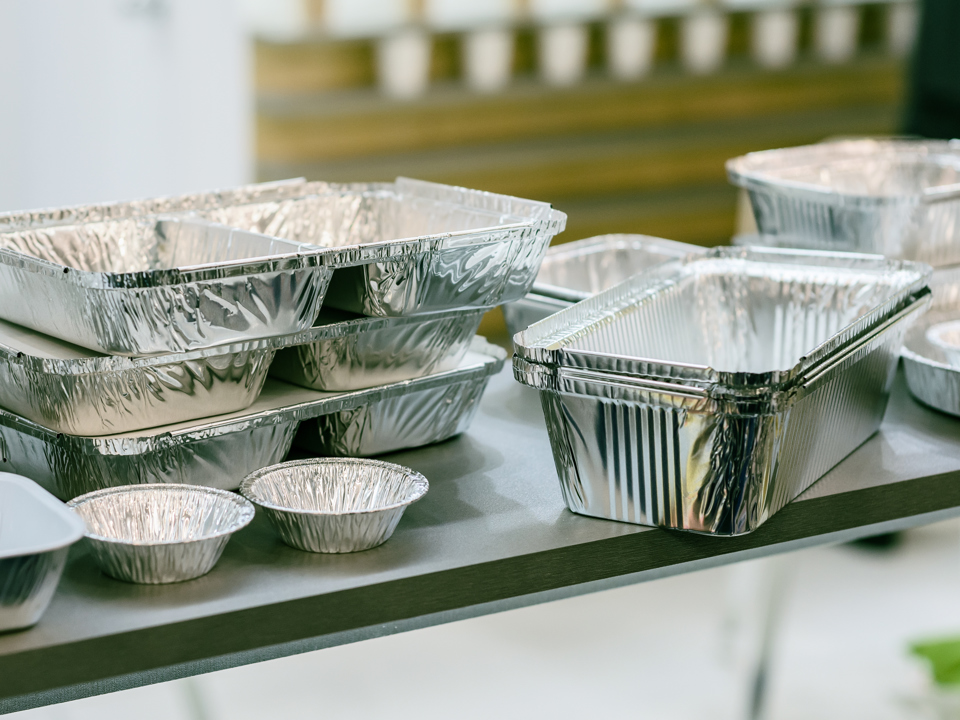 Collection of several differently-shaped food packages made of aluminium.