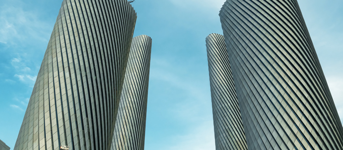 The Lusail Towers’ geometric aluminium façade on a sunny day.