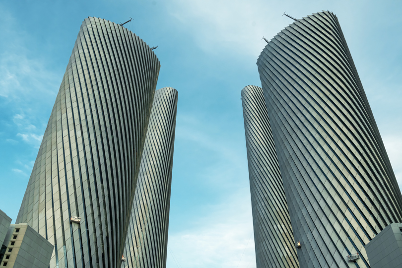 The Lusail Towers’ geometric aluminium façade on a sunny day.