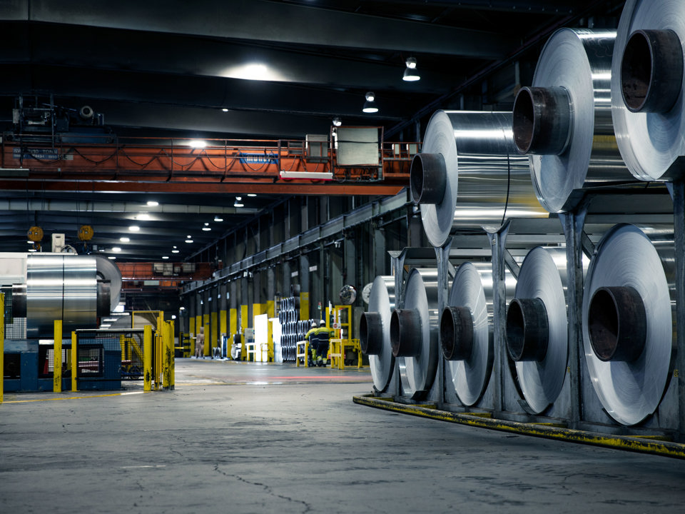 Speira’s aluminium coils stacked on top of another in a factory.