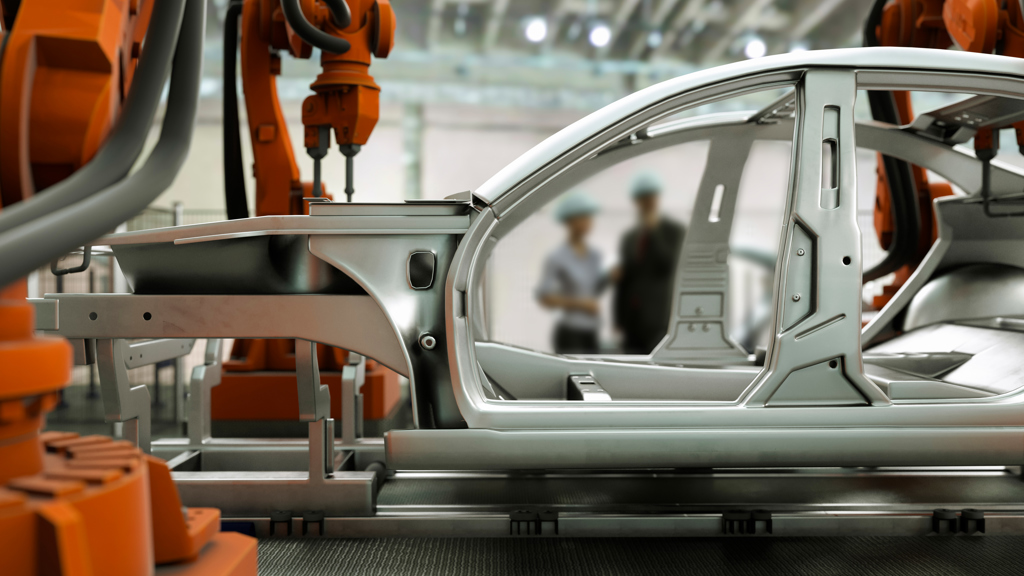 A car hull’s components in front of an exhibition setting.