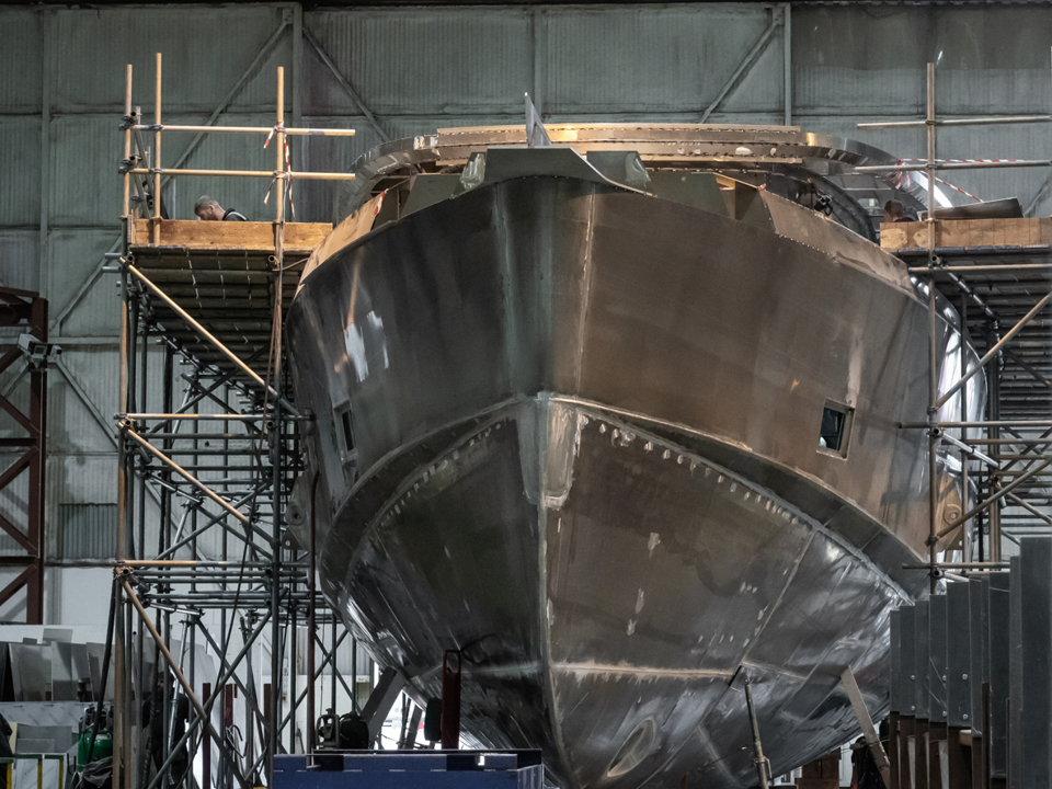 The aluminium components of a ship in a factory setting.