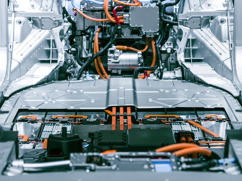 The interior of an electric car with a battery made of aluminum components.