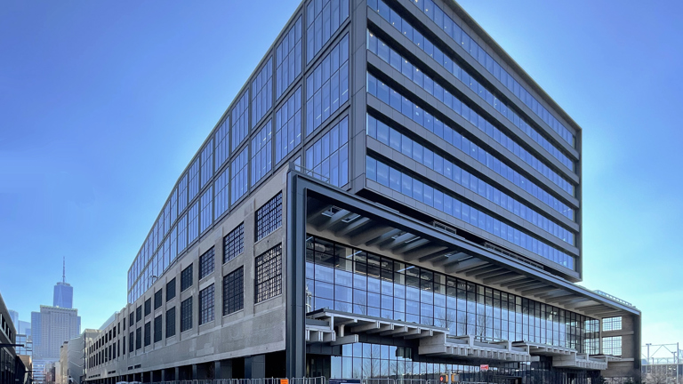 Speira’s aluminium façade of the St. John’s terminal in front of a blue sky.